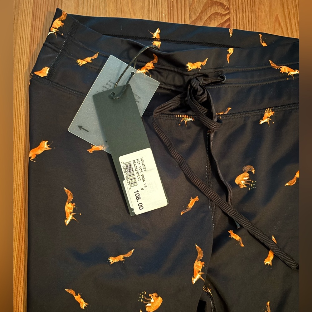 The Upside Lululemon Athletica Black and Orange Leggings